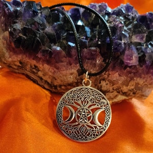 Triple moon goddess necklace with light weight leather adjustable chain. It is made of heavy solid quality alloy metal.