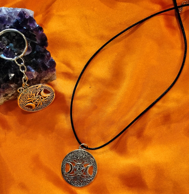 Triple moon goddess necklace with light weight leather adjustable chain. It is made of heavy solid quality alloy metal.