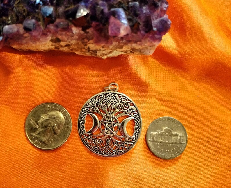 Triple moon goddess necklace with light weight leather adjustable chain. It is made of heavy solid quality alloy metal.