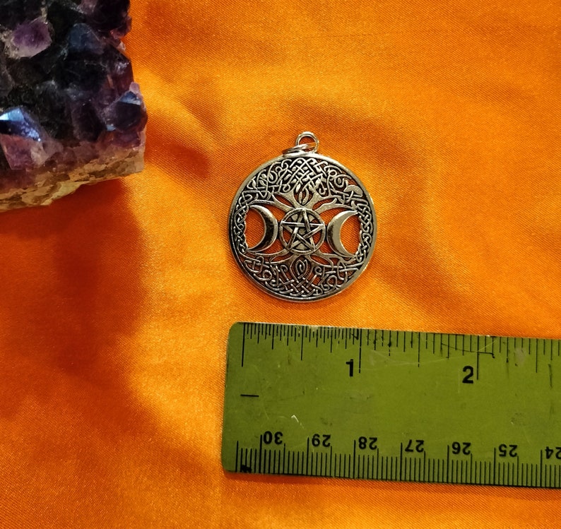 Triple moon goddess necklace with light weight leather adjustable chain. It is made of heavy solid quality alloy metal.