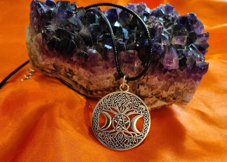Triple moon goddess necklace with light weight leather adjustable chain. It is made of heavy solid quality alloy metal.
