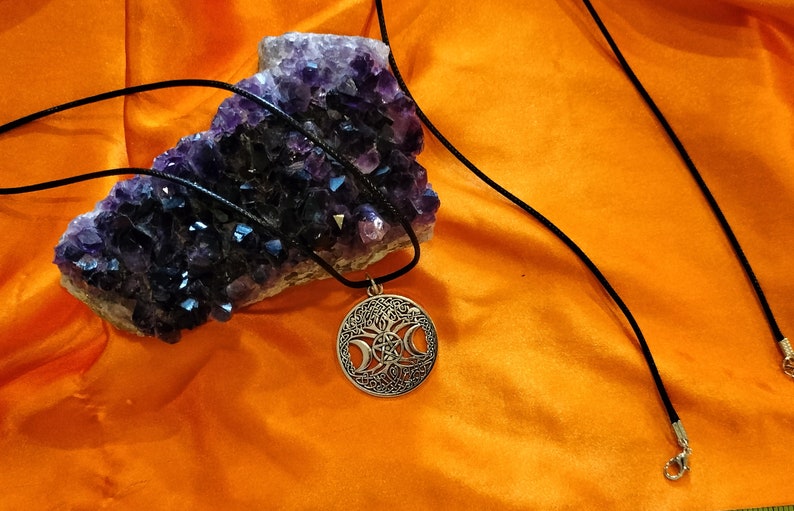 Triple moon goddess necklace with light weight leather adjustable chain. It is made of heavy solid quality alloy metal.