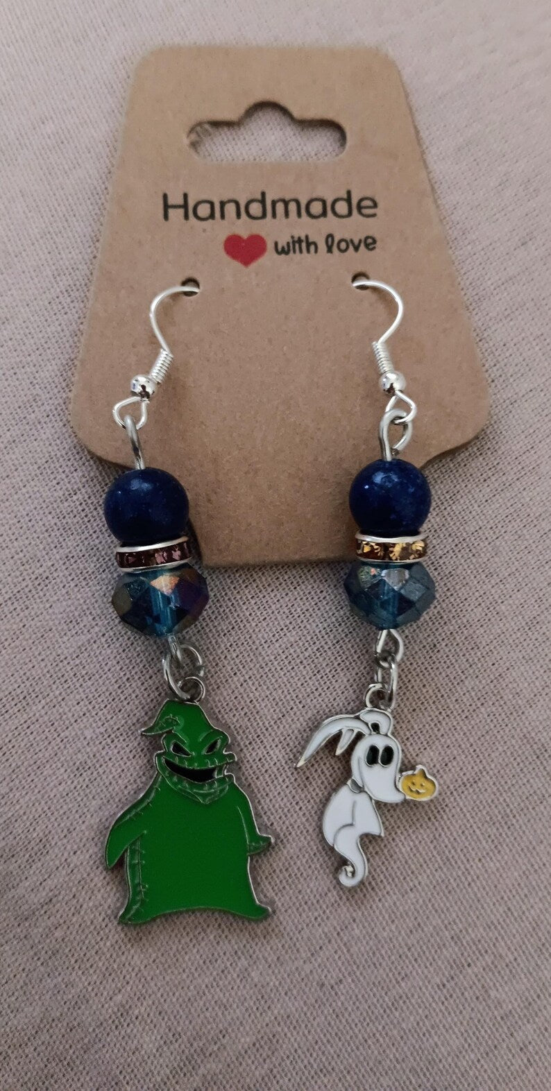 Handmade beaded assorted earrings and Tarot design bracelet and earring sets.