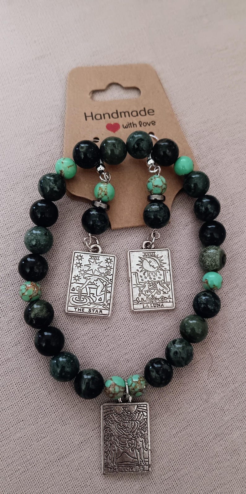 Handmade beaded assorted earrings and Tarot design bracelet and earring sets.