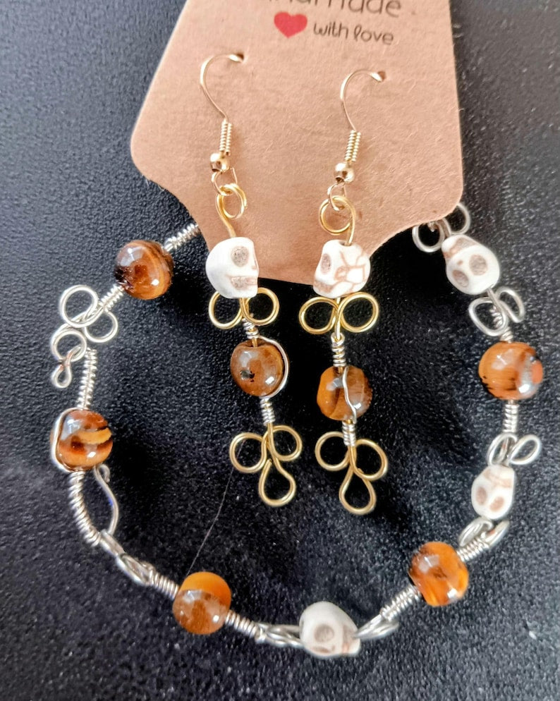 Wire Wrapped skull and tiger's eye bracelet and earrings