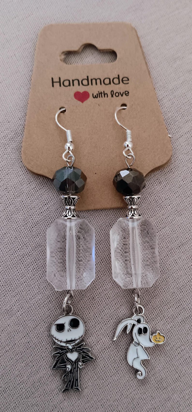 Handmade beaded assorted earrings and Tarot design bracelet and earring sets.