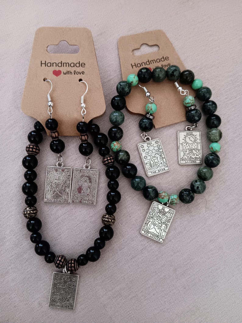 Handmade beaded assorted earrings and Tarot design bracelet and earring sets.
