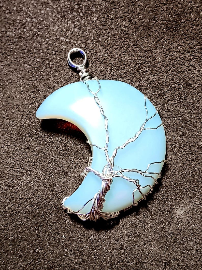 Tree of Life wrapped crystal crescent moon pendant